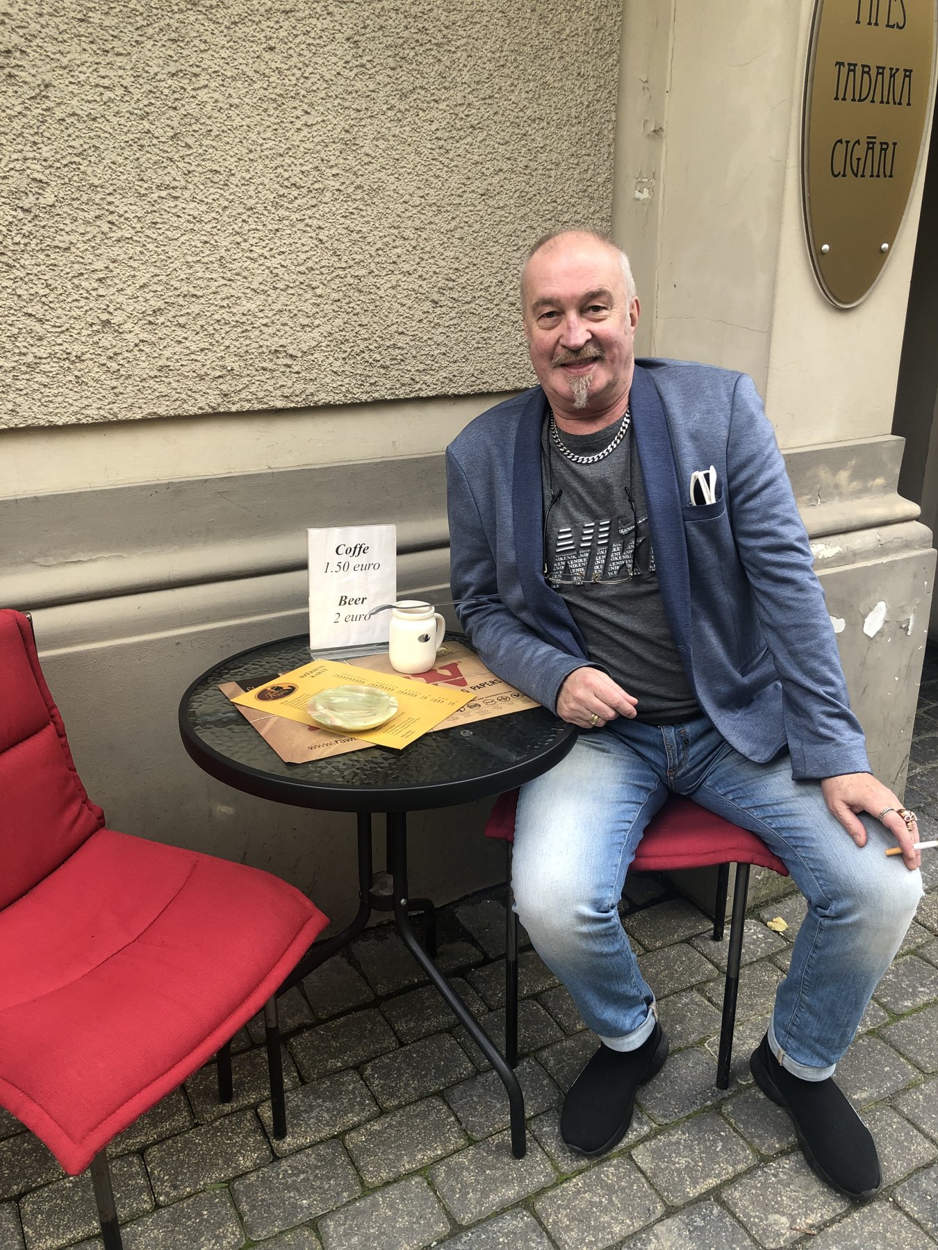 Sitting outside the shop on Alberta iela in Rīga